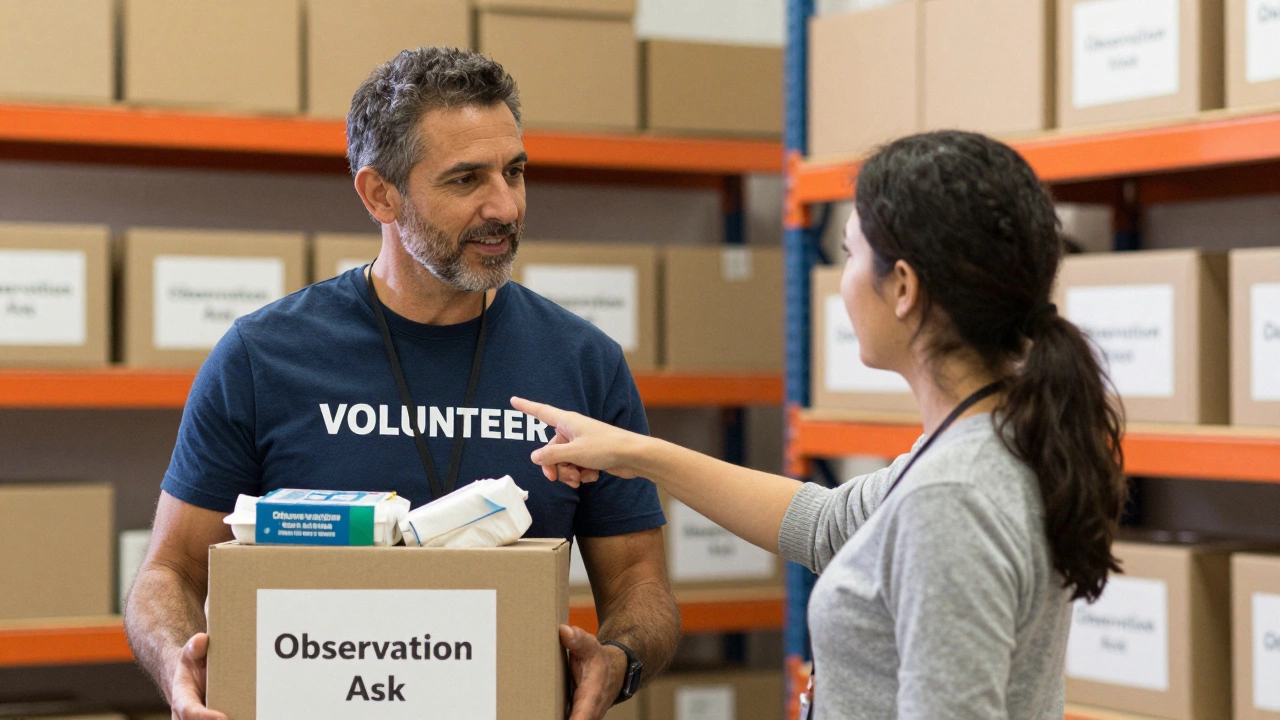 A nonprofit leader and volunteer discussing needs in a warehouse.